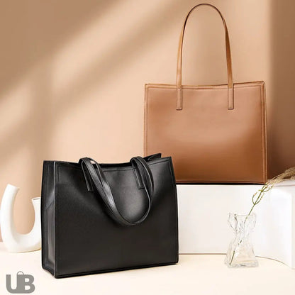 Sac fourre-tout deux coloris camel et noir Lucie en cuir posés sur une structure décorative UniversBags